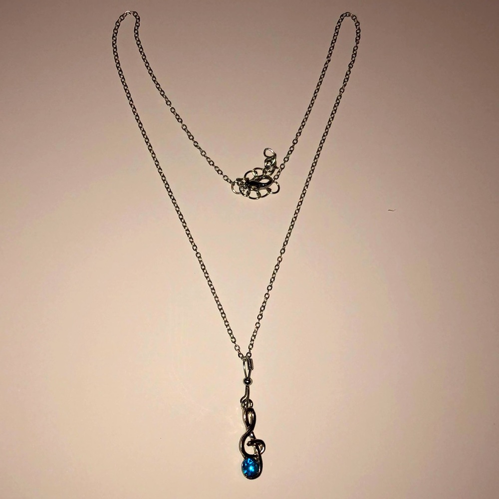 Blue music symbol note necklace.